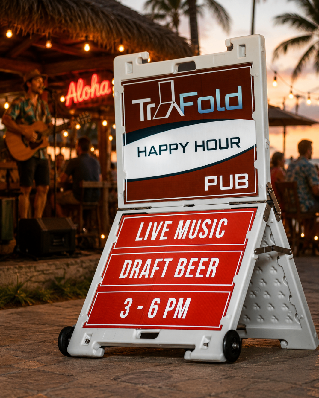TrYfold happy hour sign outside a Hawaiian bar at sunset
