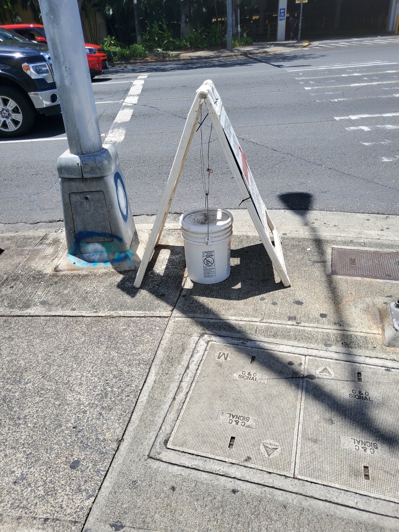 Bucket hanging from sign